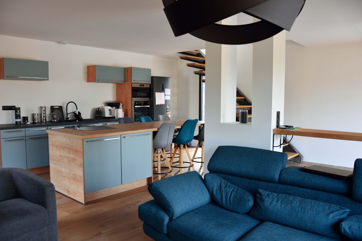 livingroom plus kitchen in a design house in Occitanie